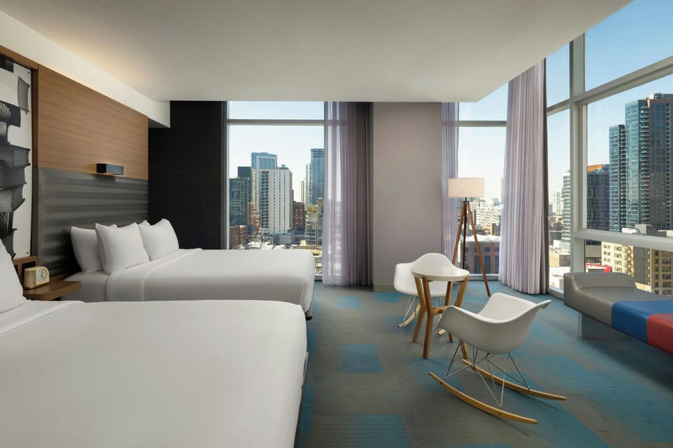Room, 2 Queen Beds, Corner (View) | In-room safe, desk, laptop workspace, blackout drapes