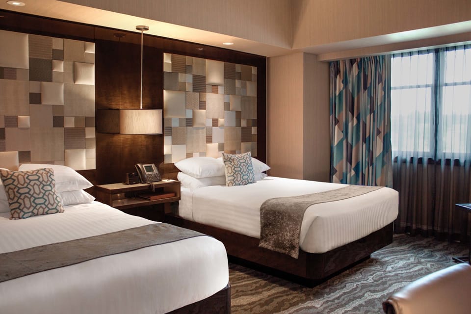 Premium bedding, pillowtop beds, minibar, in-room safe