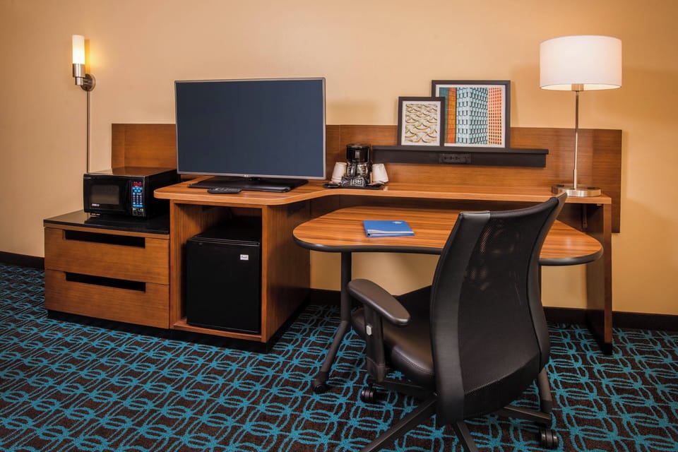 Laptop workspace, blackout drapes, soundproofing, iron/ironing board