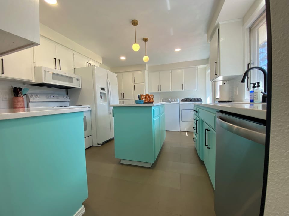 The Kitchen has plenty of guest pantry space along with the convenience of the washer and dryer 