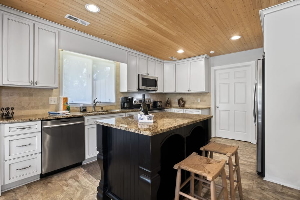 Spacious Gourmet Kitchen with laundry behind the door