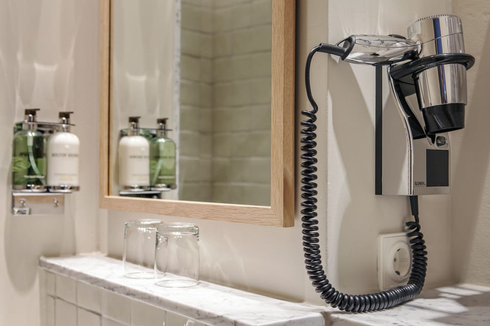 Shower, rainfall showerhead, designer toiletries, hair dryer