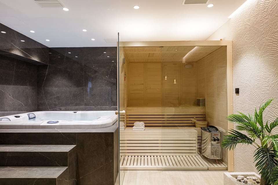 Spa area with hot tub, sauna & shower on the lower level.