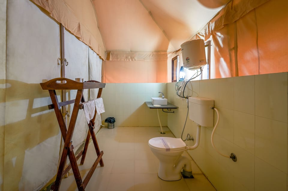 Swiss Luxury Tent | Bathroom | Combined shower/tub, free toiletries, towels, soap