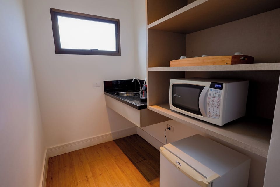 Superior Studio Suite, 1 King Bed, Balcony, City View | Private kitchen | Microwave, espresso maker, freezer