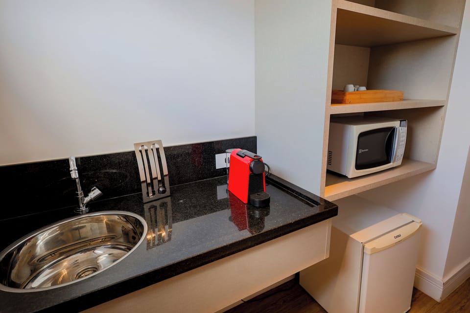 Superior Studio Suite, 1 King Bed, Balcony, City View | Private kitchen | Microwave, espresso maker, freezer