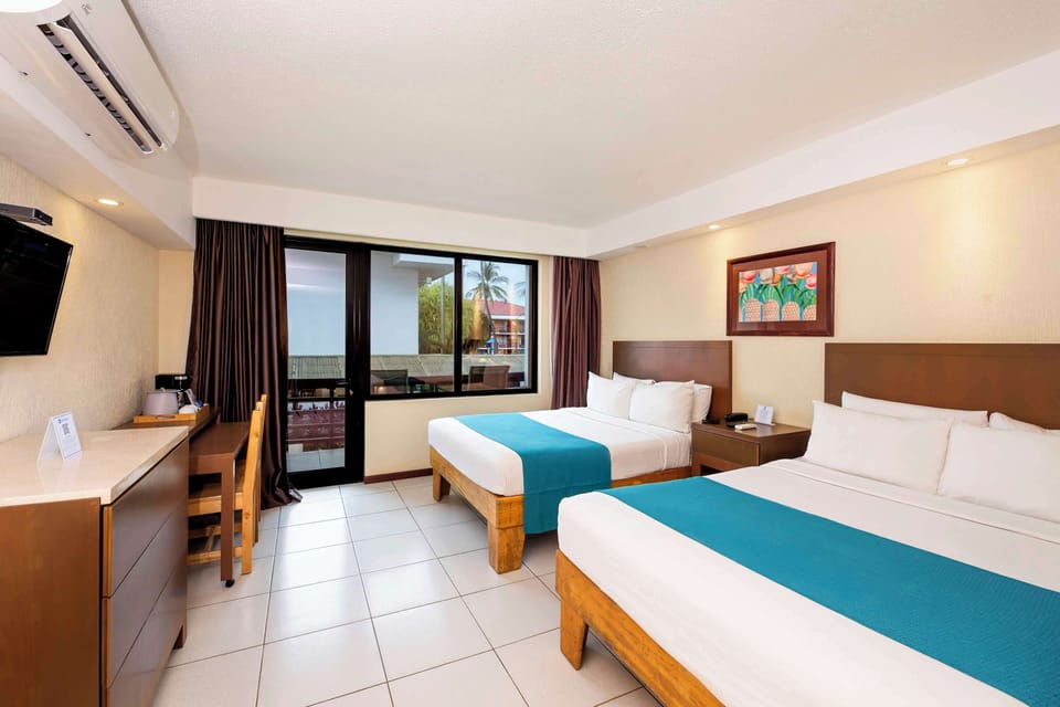 Standard Room, 2 Double Beds, Balcony, Pool View | In-room safe, desk, blackout drapes, iron/ironing board