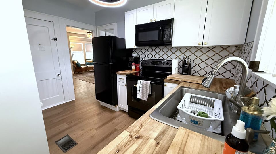Full Kitchen with fridge stove sink and microwave plus coffee bar