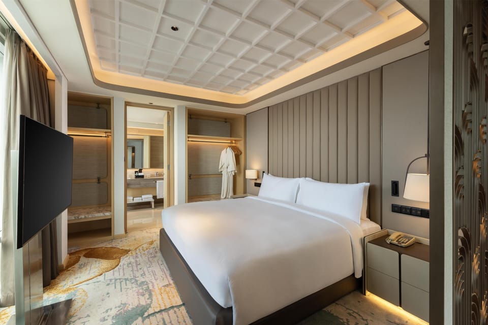 Premium Suite, 1 King Bed, Balcony | In-room safe, desk, laptop workspace, blackout drapes