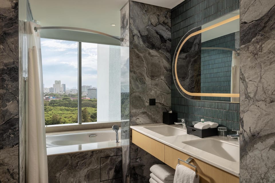 Premium Suite, 1 King Bed, Balcony | Bathroom | Free toiletries, hair dryer, slippers, bidet