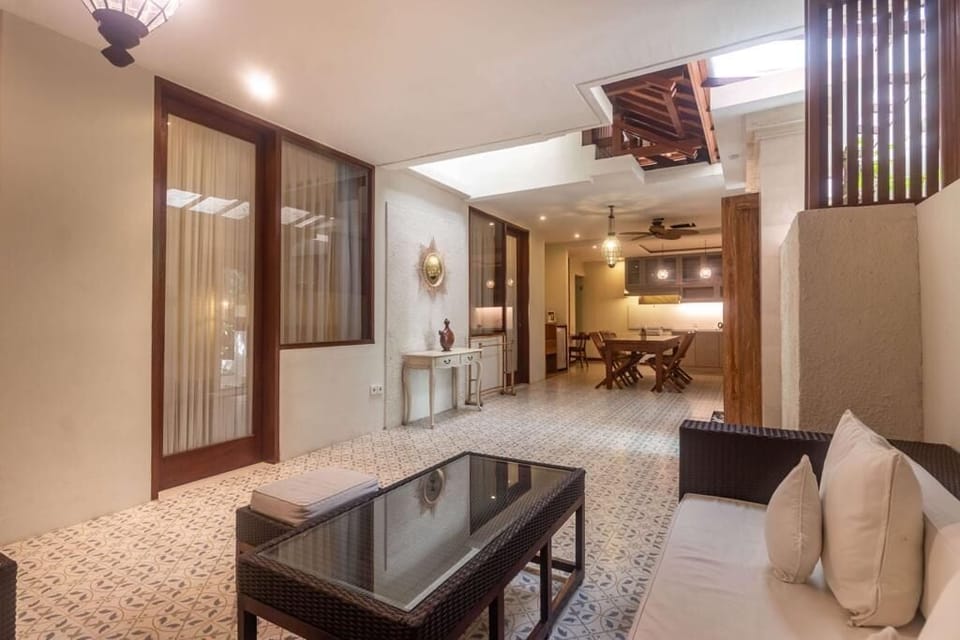 Three-Bedroom Suite | Living area | 32-inch LCD TV with cable channels, TV
