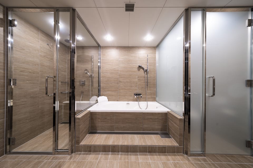 Separate tub and shower, deep soaking tub, designer toiletries