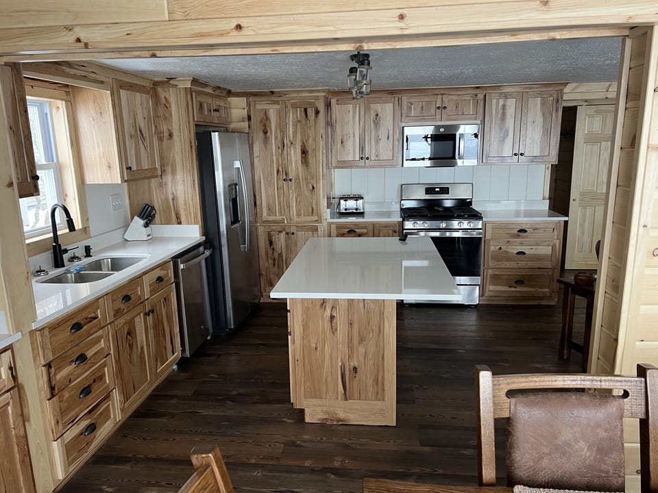 Full kitchen with all new appliances, hickory cabinets, and quartz countertops.