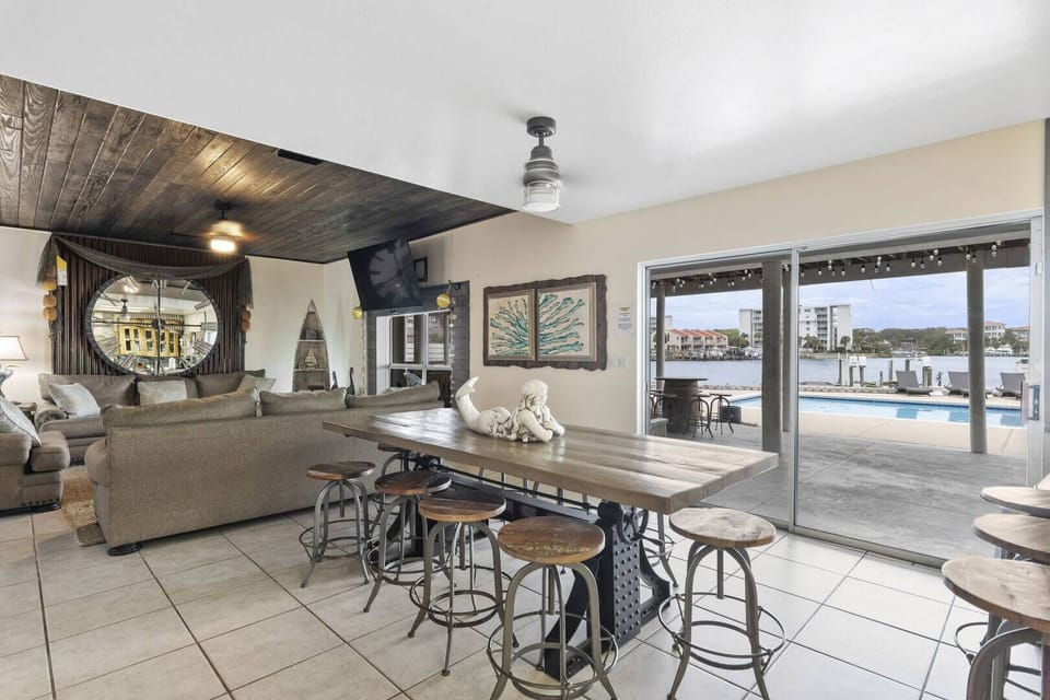 Open dining area w/ table seating & sliding doors to the balcony