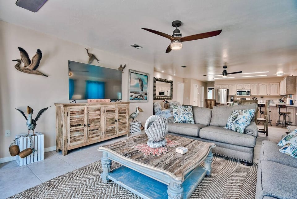 Comfortable living area w/ sofa seating & bright windows