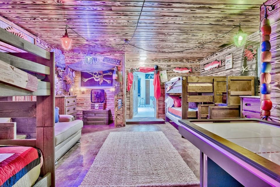 Fun bunk room w/ neon accents & a lively hangout vibe