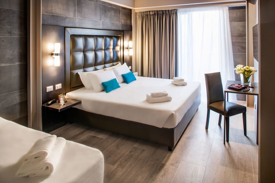Superior Triple Room, Balcony | Down comforters, minibar, in-room safe, desk