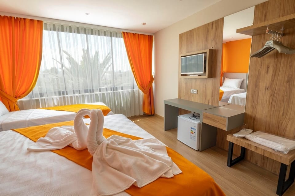 Family Triple Room | Minibar, laptop workspace, WiFi (free), individually decorated