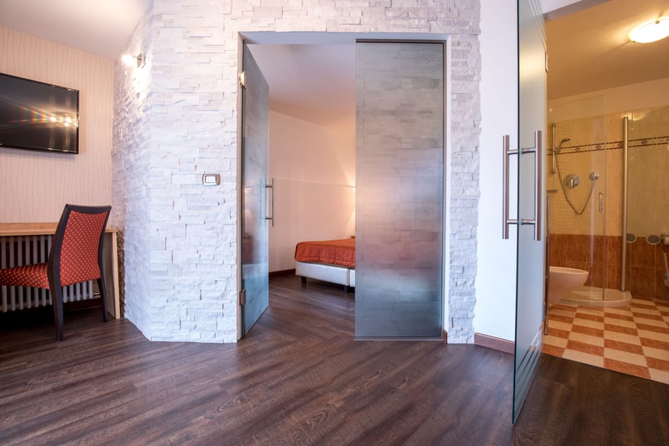 Quadruple Room | Select Comfort beds, in-room safe, desk, blackout drapes