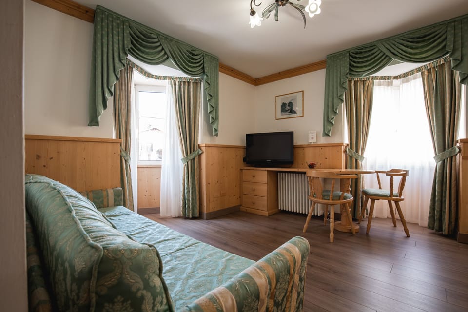 Triple Room | Select Comfort beds, in-room safe, desk, blackout drapes