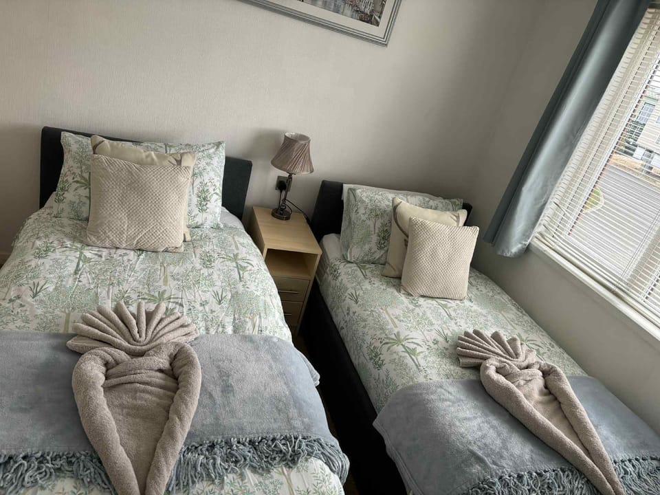 2 twin beds and closet space.