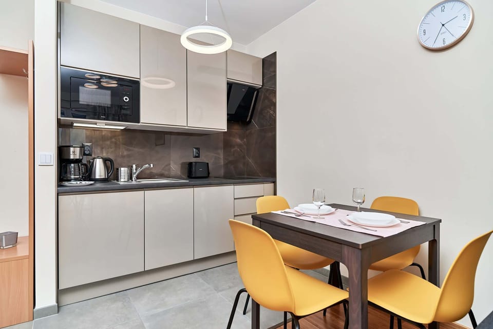 Fully equipped kitchenette with dining area.