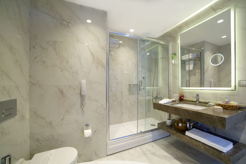 Suite, 1 King Bed | Bathroom | Spring water tub, designer toiletries, hair dryer, slippers