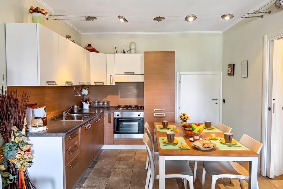 Family Apartment, 2 Bedrooms, 2 Bathrooms, Mountainside (Mansarda di Pianello) | Private kitchen | Coffee/tea maker, oven, stovetop, dishwasher