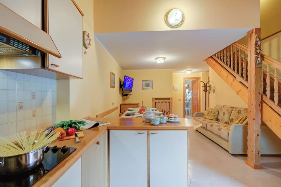 Family Apartment, 3 Bedrooms, Balcony (Genziana) | Private kitchen | Fridge, microwave, stovetop, dishwasher