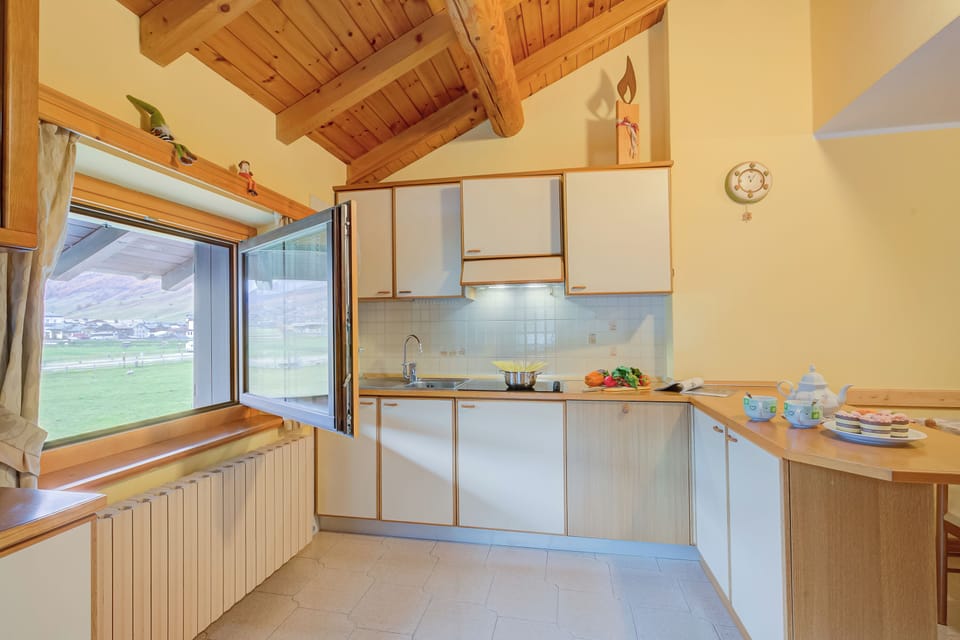 Family Apartment, 3 Bedrooms, Balcony (Genziana) | Private kitchen | Fridge, microwave, stovetop, dishwasher
