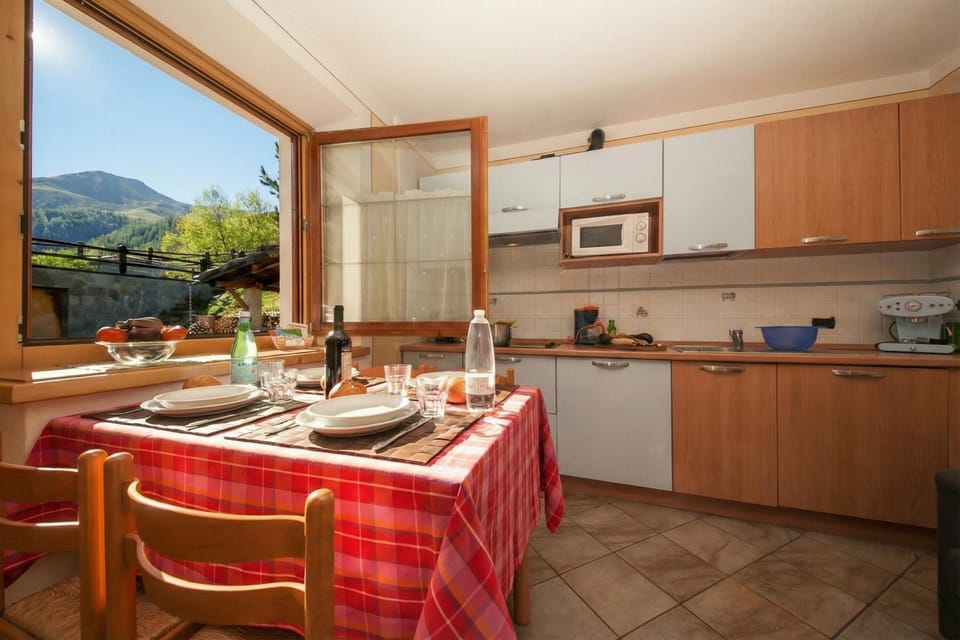 Family Apartment, 2 Bedrooms, Microwave (Italia 2 Ski in-Ski out 50m) | Private kitchen | Coffee/tea maker, fridge, microwave, stovetop