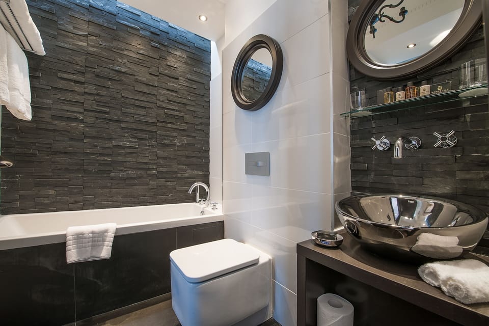 Separate tub and shower, rainfall showerhead, designer toiletries