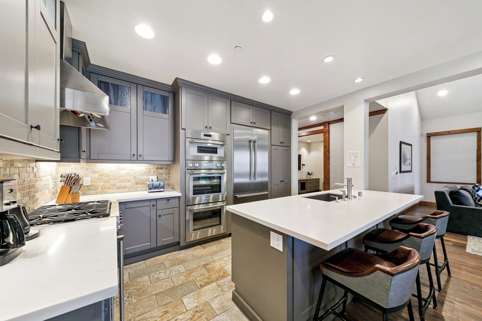 Chef’s kitchen with high-end Thermador appliances, double ovens, and 5-burner cooktop