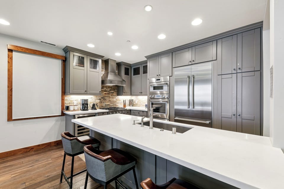 Spacious kitchen island with bar seating—ideal for breakfast, meal prep, or gathering with family