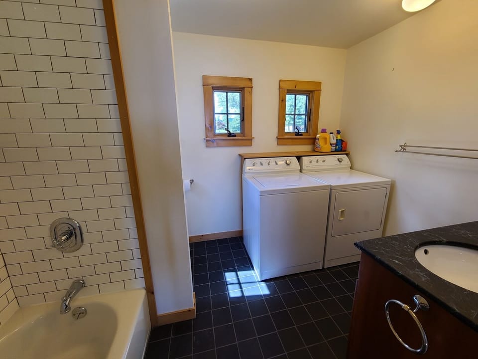 Main floor full bathroom and laundry.