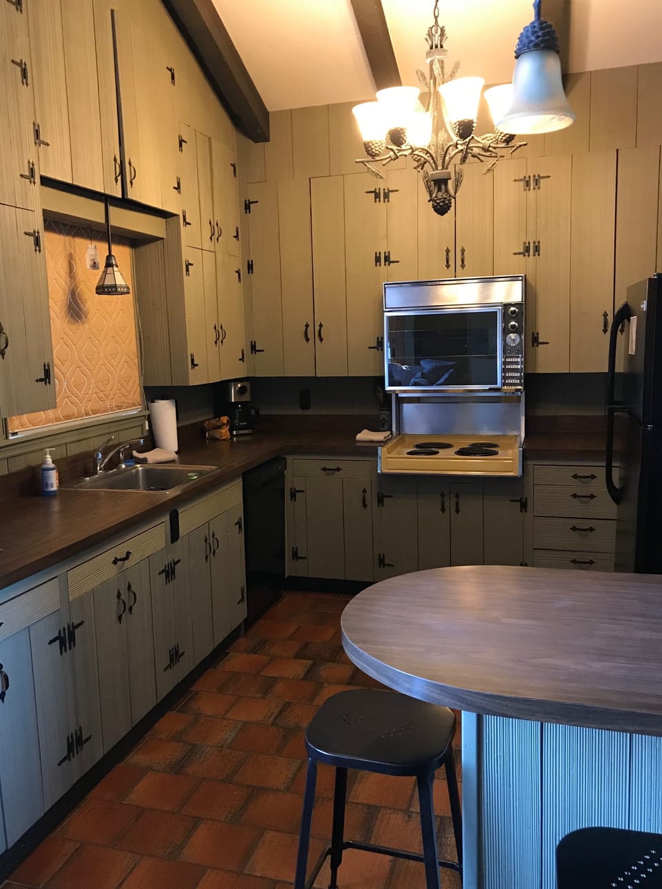 Retro and eclectic! The kitchen is stocked with everything for your dining needs