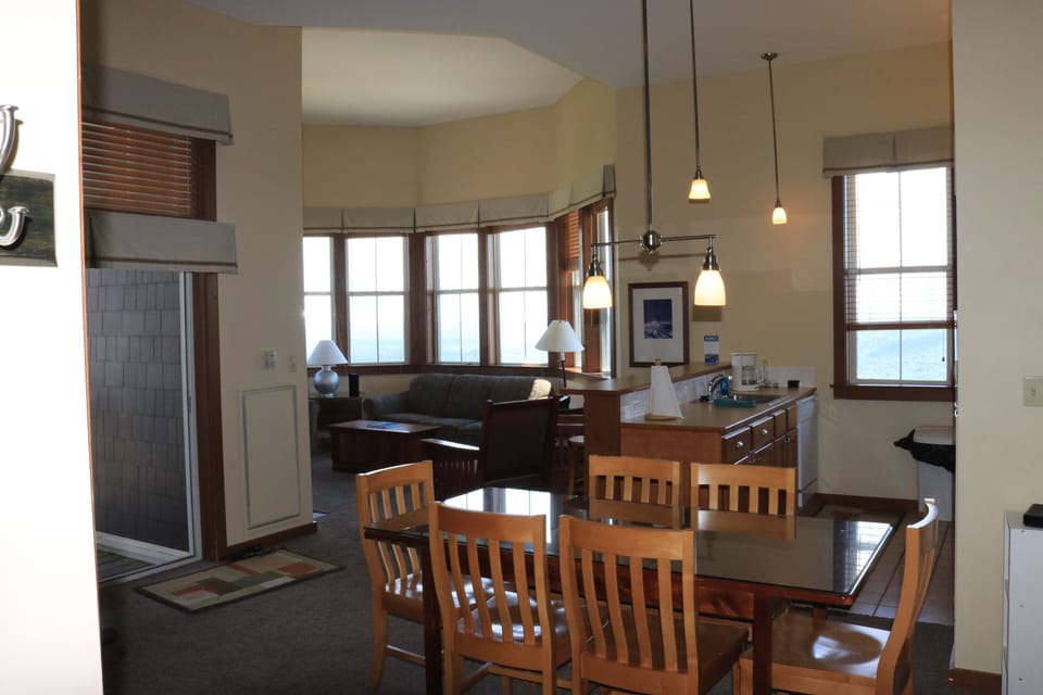 Dining Room Table comfortably sits 6.  extra chairs to accommodate 8. Older pic 