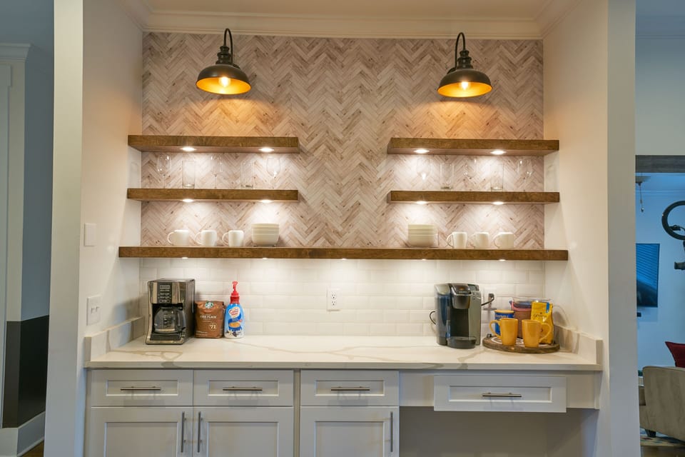 HGTV-esque open style shelving in the kitchen, complete with a coffee bar