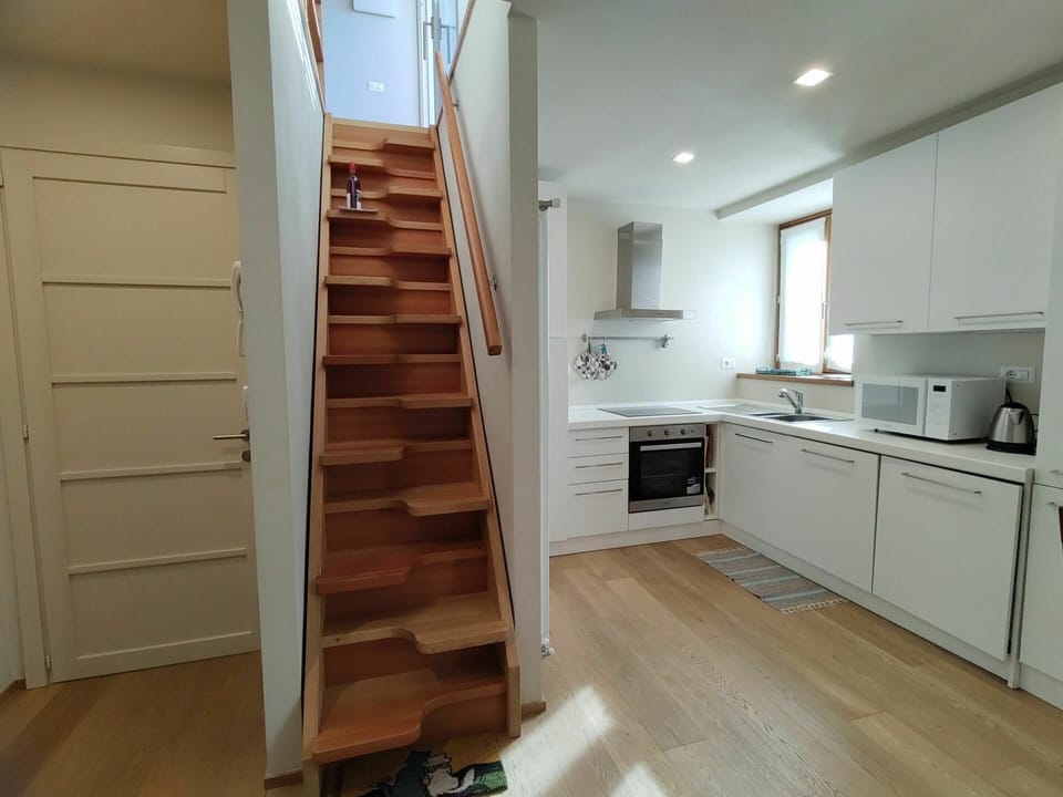 Cabinetry, Furniture, Property, Countertop, Building, Drawer, Sink, Wood, Stairs