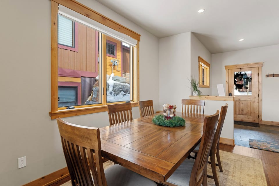 Gather around your warm wood dining table for memorable meals with mountain views through picture windows.