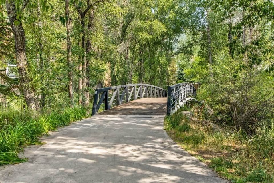 Creek crossing: Bridge outside Riverview building offers relaxing strolls and views.