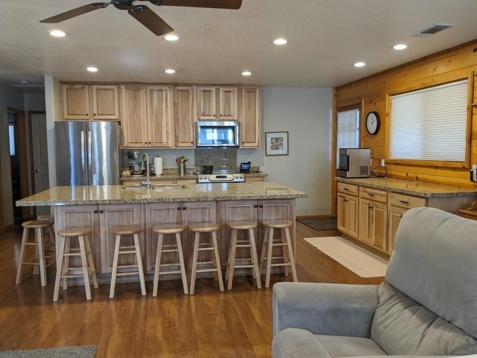 Huge kitchen with 8 seats around the island.
