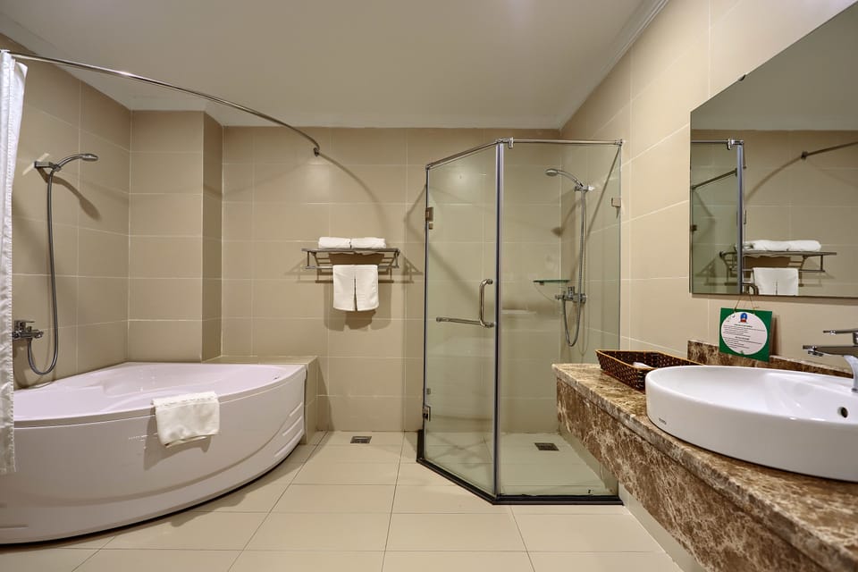 Deluxe Double Room | Bathroom | Deep soaking tub, hydromassage showerhead, designer toiletries