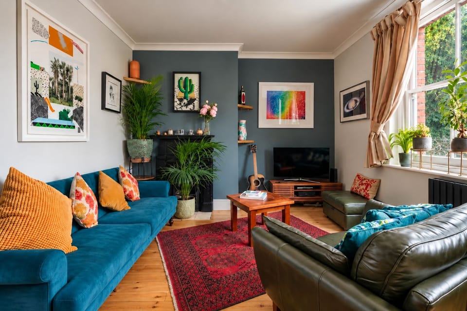 Colourful & warm, with art filled walls, comfy sofas & plants 🪴 
