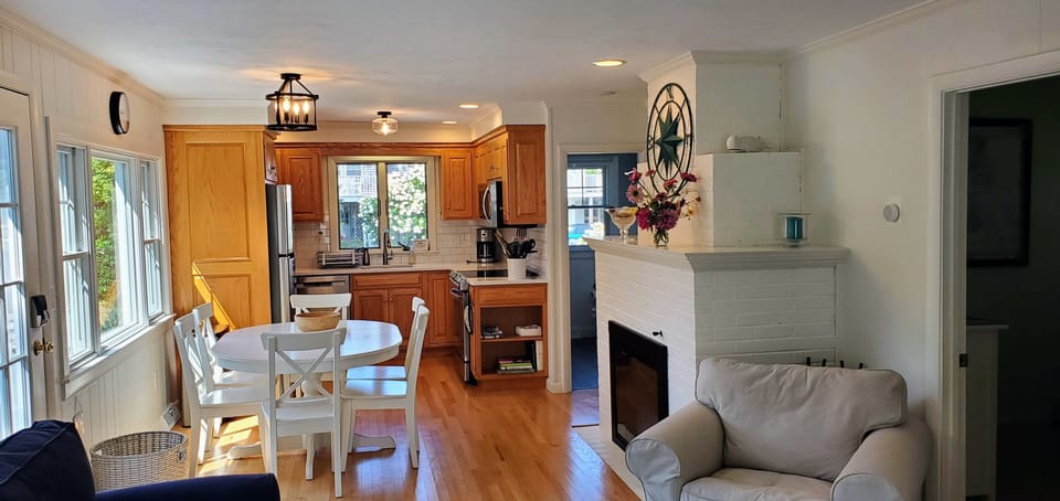 A view from the family room towards the kitchen and dining area