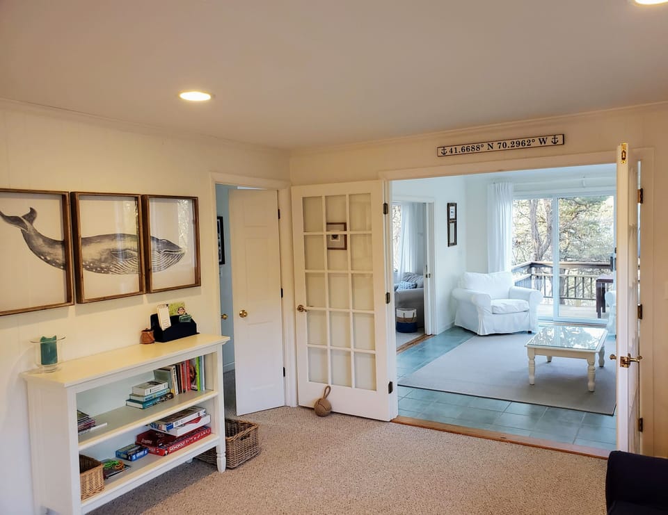 The family room, with books and games for those classic Cape Cod game nights