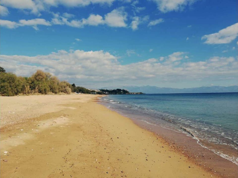 Embrace the seaside allure with a sandy beach just 100 meters away