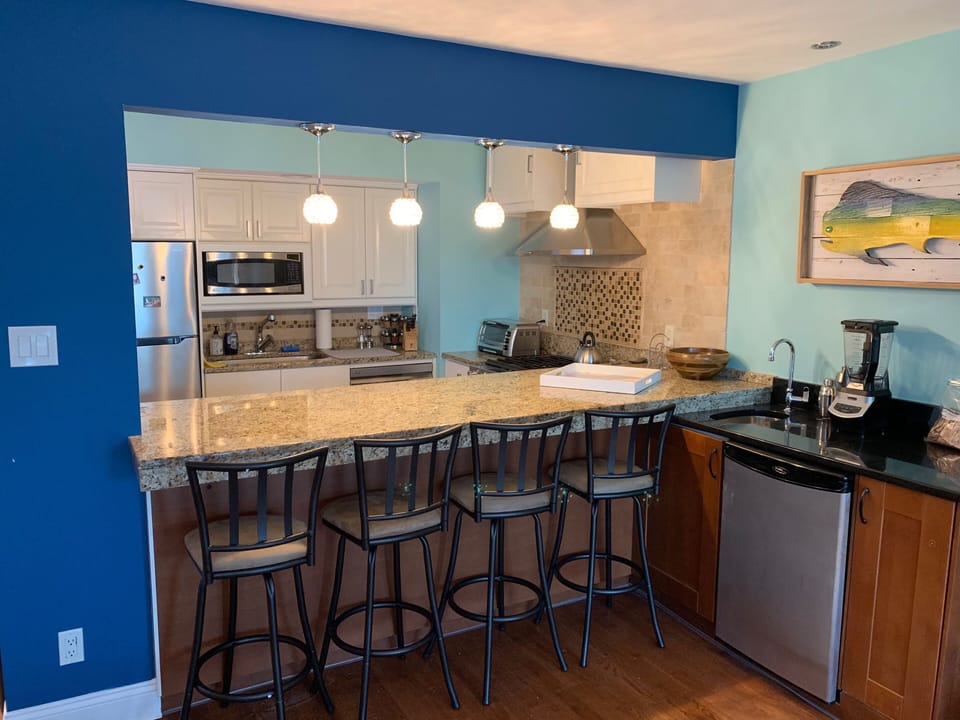 Blend a margarita or brew a coffee on the wet bar adorned by Mahi Mahi art