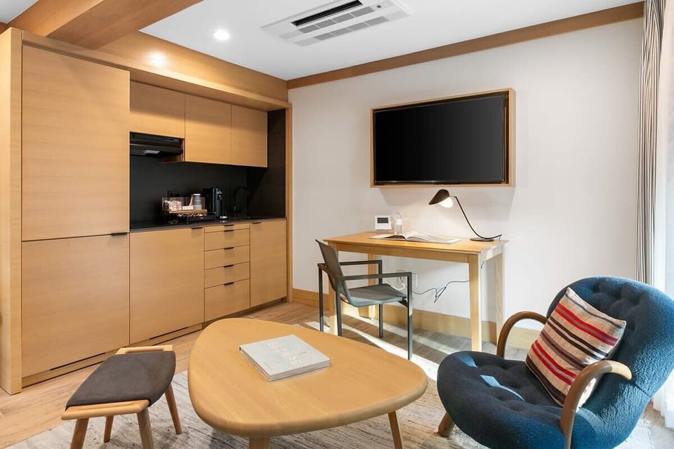 Kitchenette equipped with a Ninja blender, Nespresso Verturo coffee station with pods, mini-fridge and freezer.