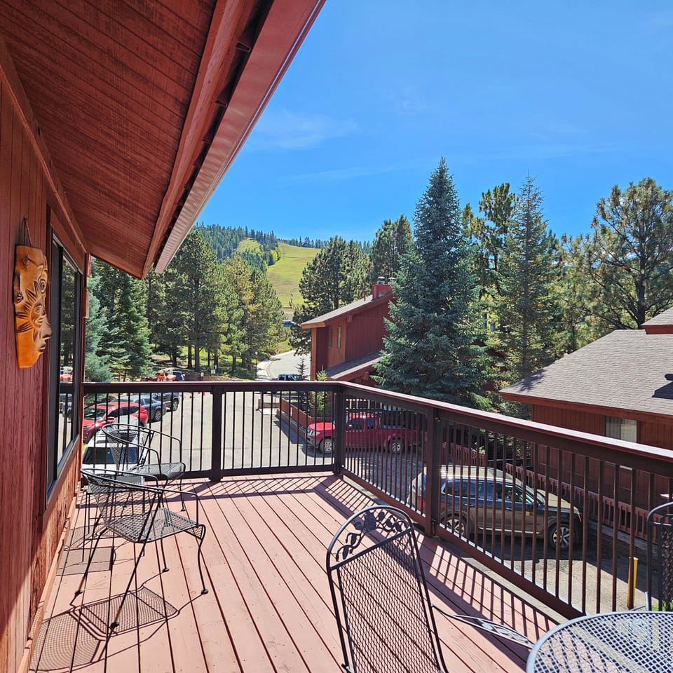 Watch the skiers or mountain bikers from the deck